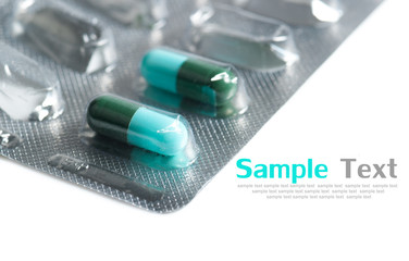 Capsules packed in blisters, isolated on white