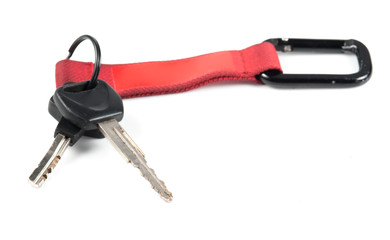 Car key and red silicone cover on white background