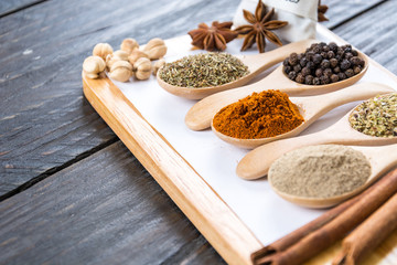 Spices and herbs in  bowls.