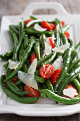 Warm salad with green beans and parmesan cheese