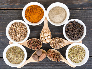 Spices and herbs in  bowls.
