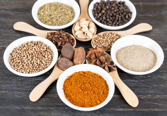 Spices and herbs in  bowls.