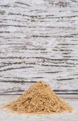 Lemongrass powder over wooden background