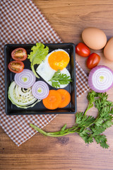 Eggs poached with vegetables on cloth background