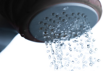 shower head showing drops and streams of water,Selective focus.