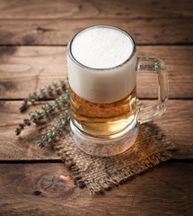 glass of beer on wooden table