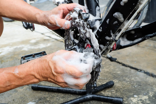 Hands of mechanic fixing a bicycle