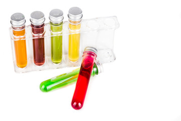 Test tubes with multi color chemicals isolated in white
