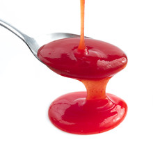 Tomato Ketchup Or Red Sauce on spoon isolated on white,Selective
