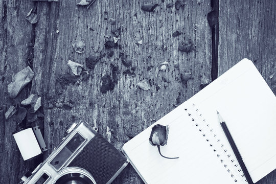  black&white image notebook,pencil,camera