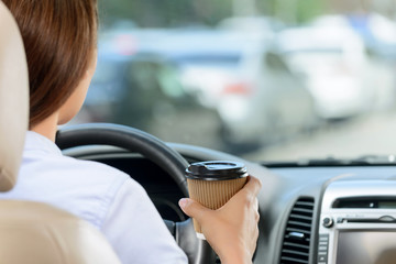 Pleasant girl driving a car 