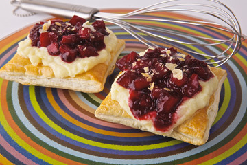 Pastry with cream and plums