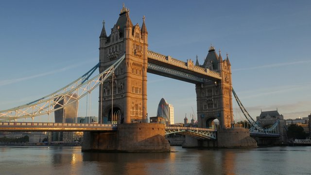 Wide static shot of Tower Bridge on a stunning clear autumn morning with beautiful sunlight. Original footage is 4K