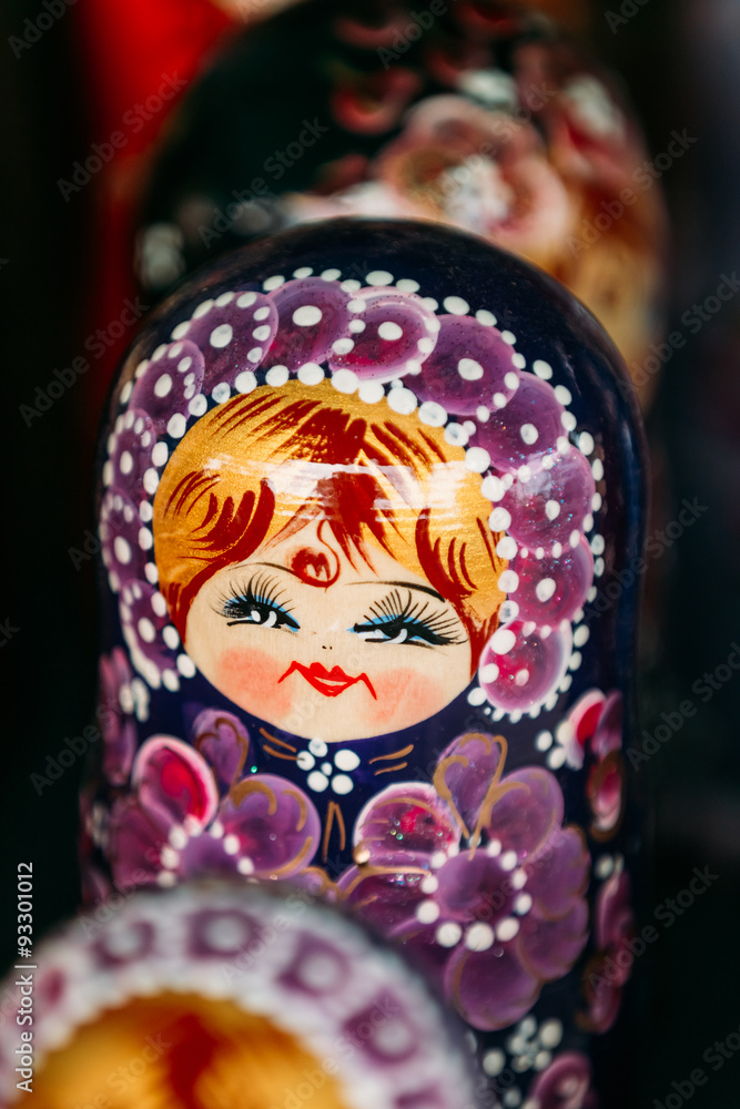 Wall mural Colorful Russian Nesting Doll Matreshka At Market. 