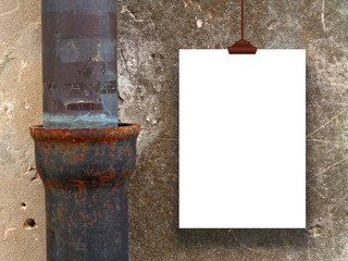 Single frame with clip on concrete wall near metal pipe