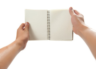 Obraz premium hand holding a book. isolated over white background