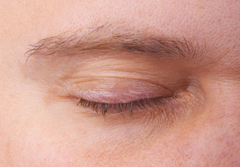 Fototapeta na wymiar Closed men's eyes and eyebrows