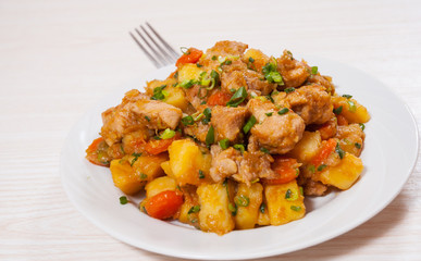stewed meat with potatoes, onion and carrot