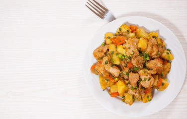 stewed meat with potatoes, onion and carrot