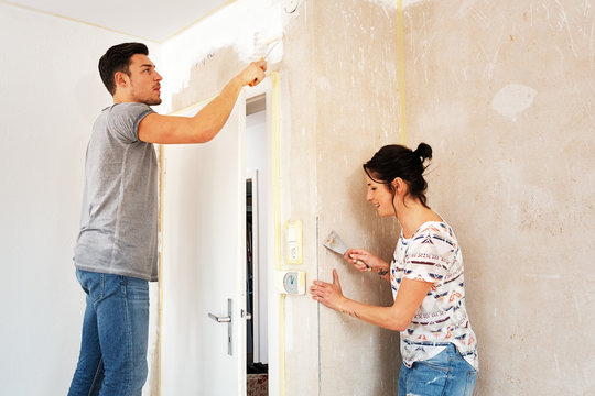 Couple renovating the new dwelling