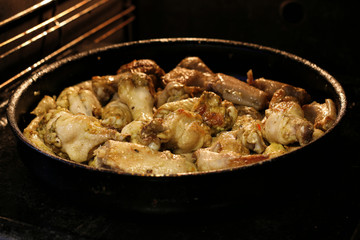 Chicken wings are baked in the oven