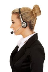 Happy young businesswoman with headset
