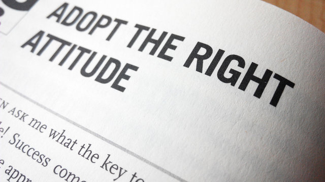 Adopt the right attitude word on a book