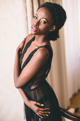 Young black woman in the room