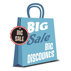 Isolated blue shopping bag with the text big sale, big discounts written on the bag