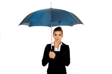 Surprised businesswoman holding an umbrella