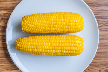 Boiled corn on white bowl