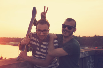 Two young skater having fun outdoors.