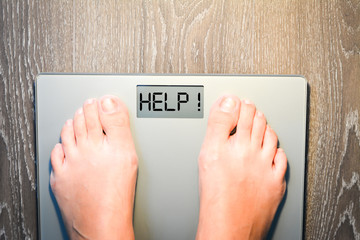 Lose weight concept with person on a scale measuring kilograms