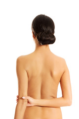 Back view of slim topless woman
