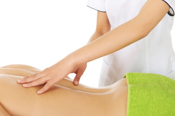 Young woman is being massaged. 