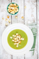 homemade cream soup with broccoli and croutons