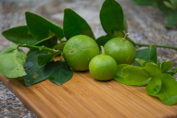 lemons on wooden cutting board