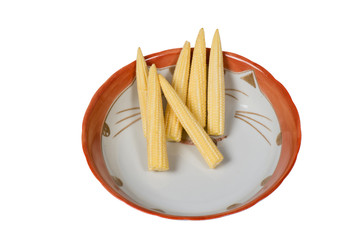 Baby corn on the inside of the cat-shaped bowl with white background

