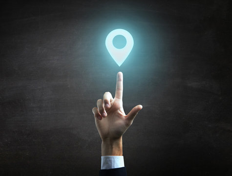 beautiful Business male hand indicating location icon