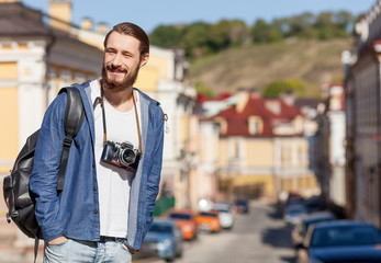 Handsome young guy is making journey across town