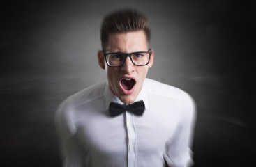 Close up of a young angry genius .