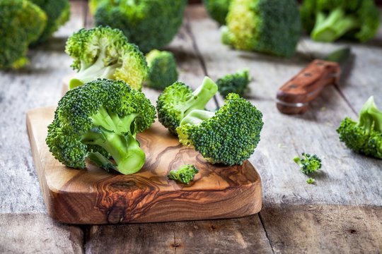 Fresh raw organic broccoli cutting board