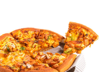 Pizza with ham, tomatoes, mushrooms and chicken isolated on whit