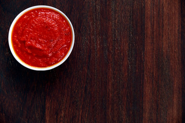 Italian Marinara sauce on wooden background