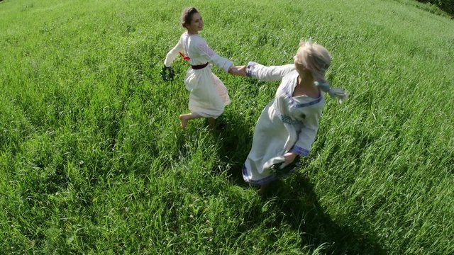 Ethnic wear girl dancing and playing at meadow