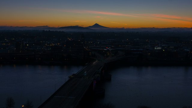 Ultra High Definition 4k Time Lapse of Sunrise Over Mount Hood and City of Portland Oregon with Traffic across Morrison Bridge along Willamette River One Early Morning 4096x2304