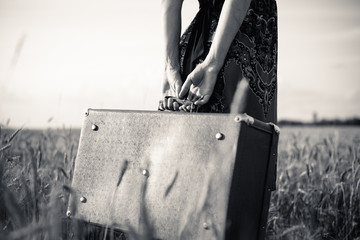 Black and white picture of slim female's arms  holding retro