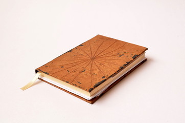 Book/Book with brown cover isolated on white background.
