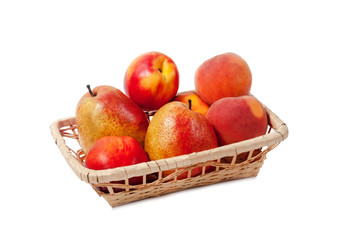 Fruits in a basket isolated on white background