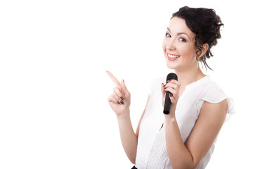 Young female speaker with microphone advertising on white backgr